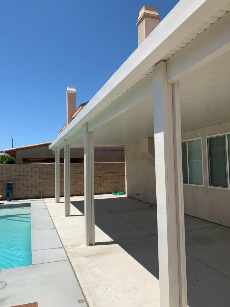 Duralum solid flat-panel patio cover on a DFW home