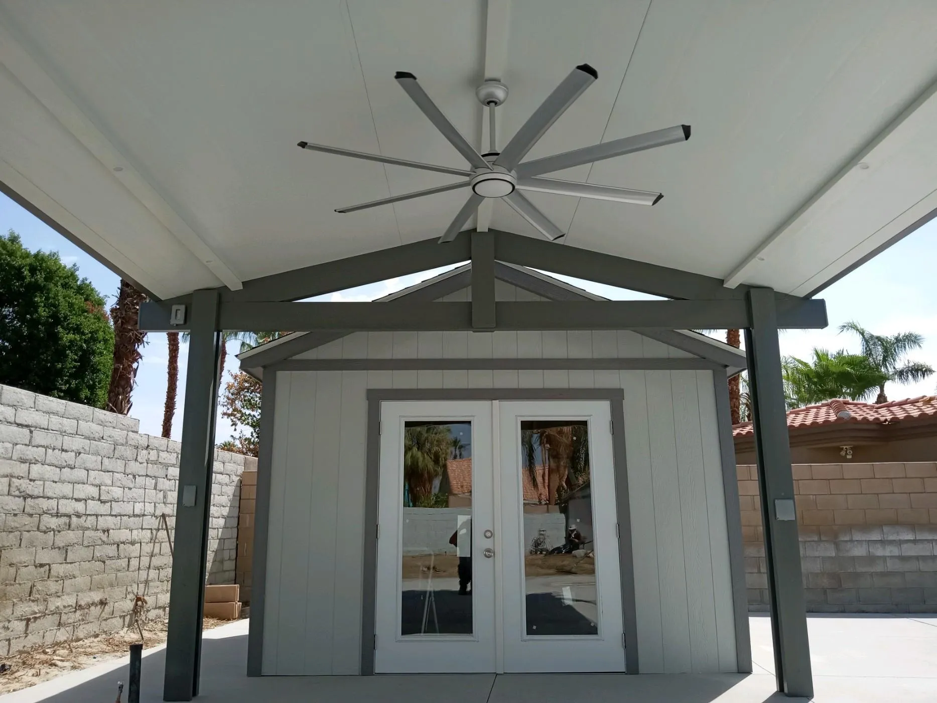Duralum freestanding insulated gable roof for a covered outdoor area