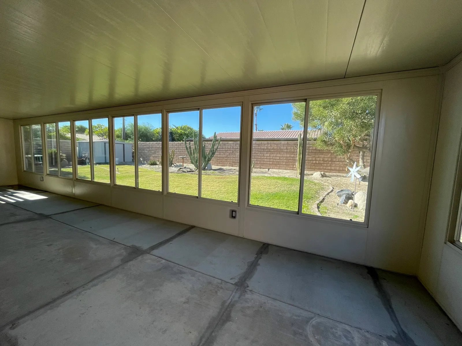 Duralum room enclosure interior view looking out through glass panels