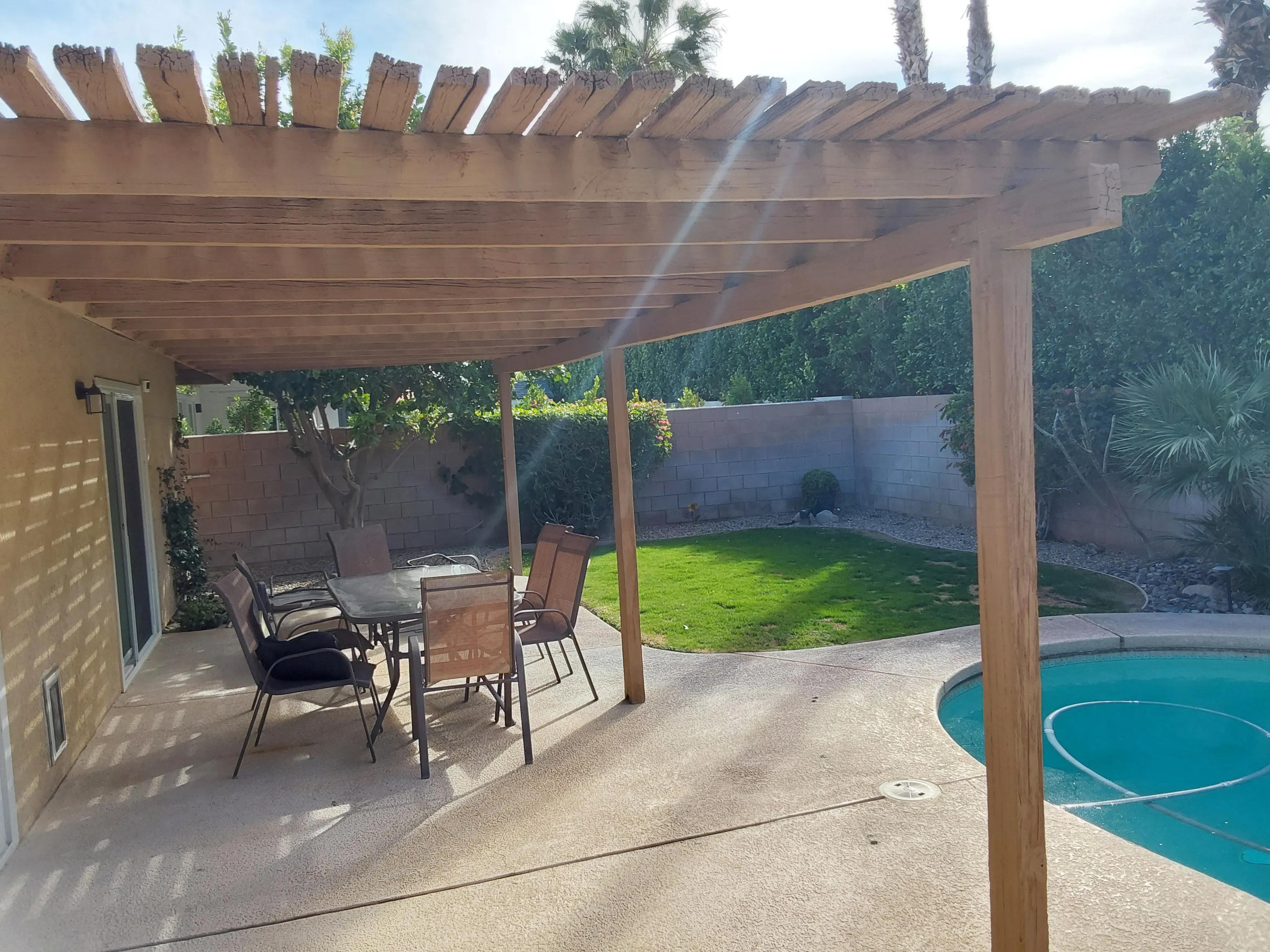 Cracked wood pergola after a few years of weather exposure